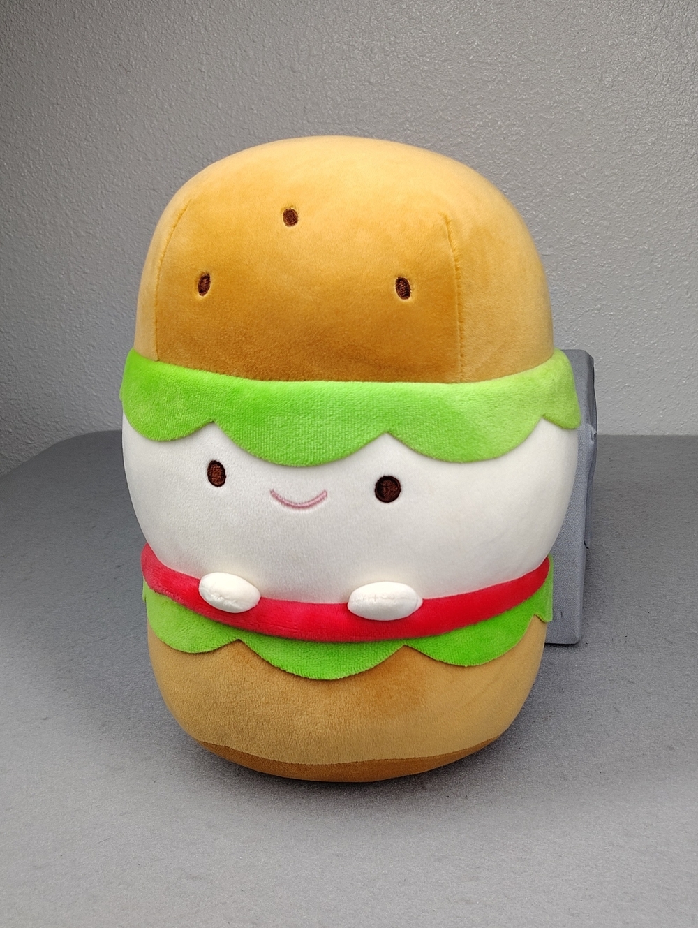 Miniso Food Series Hamburger Plush Toy featuring a smiling Kawaii face
